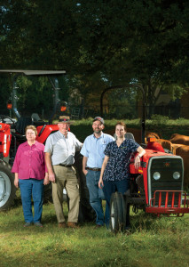 Along with wife Annette, son Nathan, and daughter Aaron, Dr. Lanier Orr (second from left) runs Orr Animal Hospital in Forsyth. He also raises Red Angus cattle—the same color as his Massey Ferguson tractors, his favorite brand—on about 400 total acres in Forsyth, Dawson, and Elbert counties.