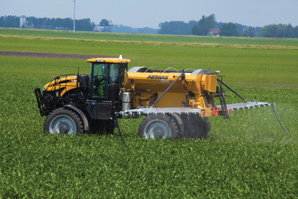 An AirMax 180 pneumatic spreader applying prescribed fertilizer to crops.