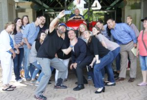 Robby Clemens at AGCO Headquarters taking selfie with employees.