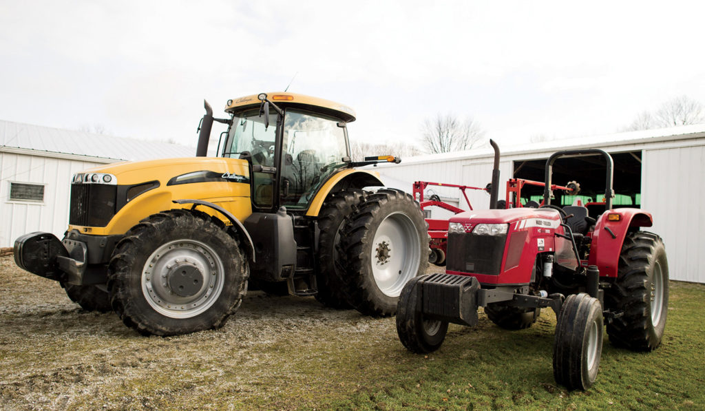 A Challenger MT665C tractor and a Massey Ferguson MF2680 tractor