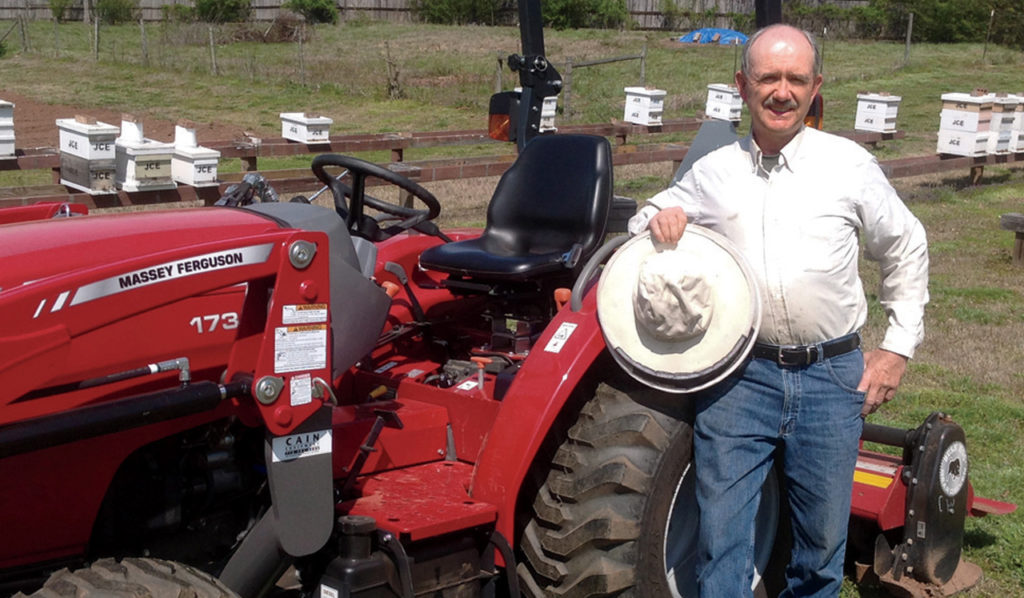 Jim Ellis and his Massey Ferguson 1734E utility tractor.