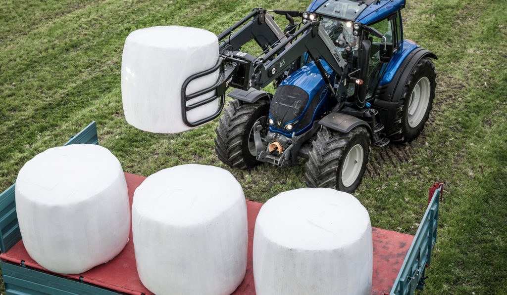 White Silage Bales Valtra Tractor